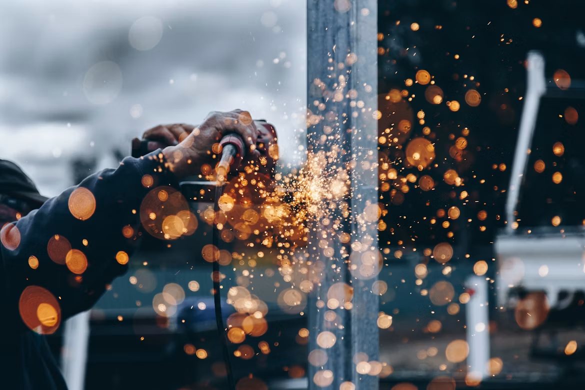 A worker amid sparks in the workshop