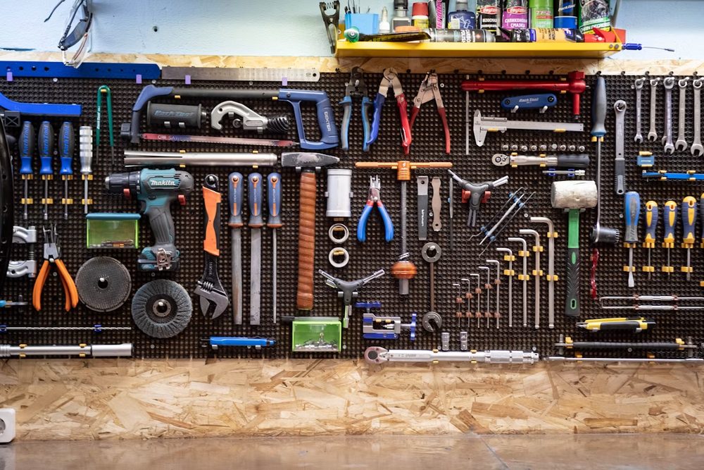 Hand tools and hardware on a workshop wall